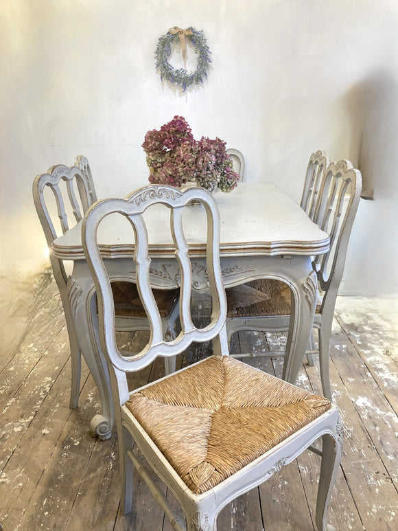 Painted antique French expanding dining table and chairs