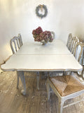 Painted antique French expanding dining table and chairs