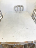 Painted antique French expanding dining table and chairs