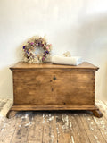 Large antique trunk on feet